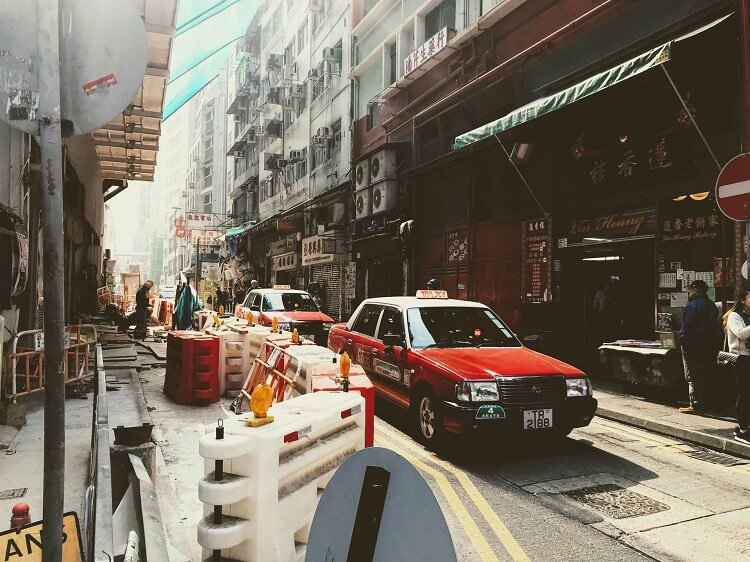 Hong Kong taxis in narrow street